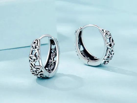 Sterling silver hollow butterfly earrings with zircon stones measuring 14mm by 5mm