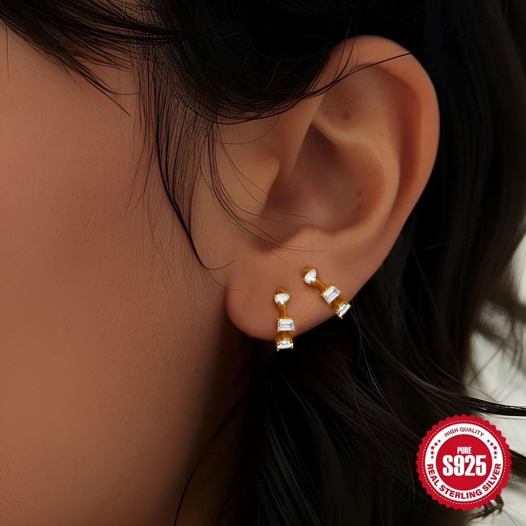 Sterling silver geometric stud earrings with small round diamond detailing in gold and silver electroplated finishes