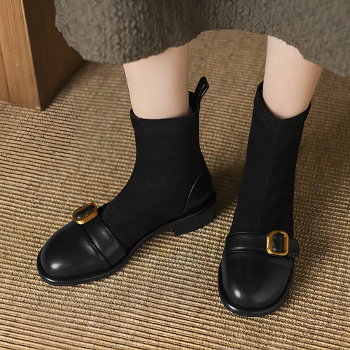 Women's black casual Martin ankle boots with lace-up front and buckle stitching detail on a low heel.