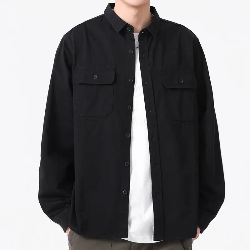 Man wearing a loose fit, long sleeve cardigan-style shirt overall in khaki polyester fabric.