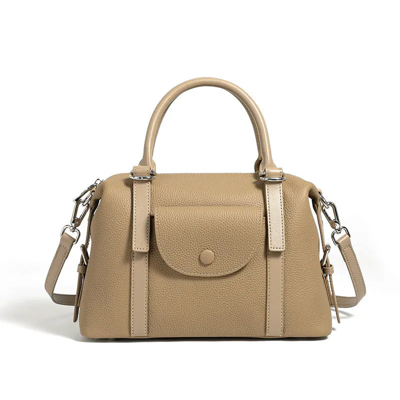 Genuine leather ladies handbag in black, brown, or elephant grey with contrast stitching and a lock.