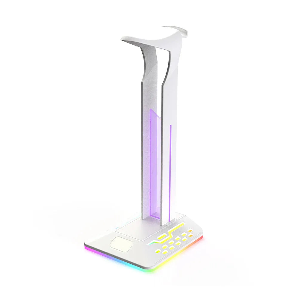 RGB colour changing headphone display stand with dual USB ports on a desk