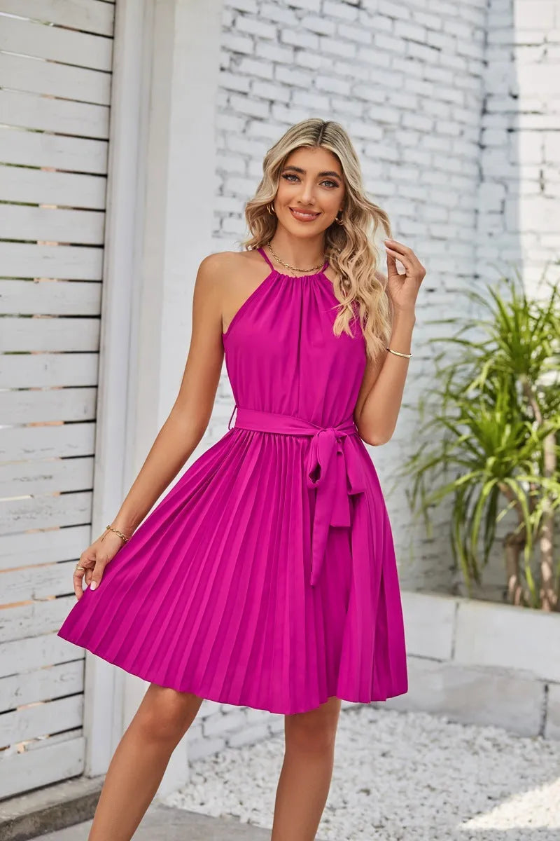 Women's black halter neck strapless dress with pleated midi skirt and waist belt