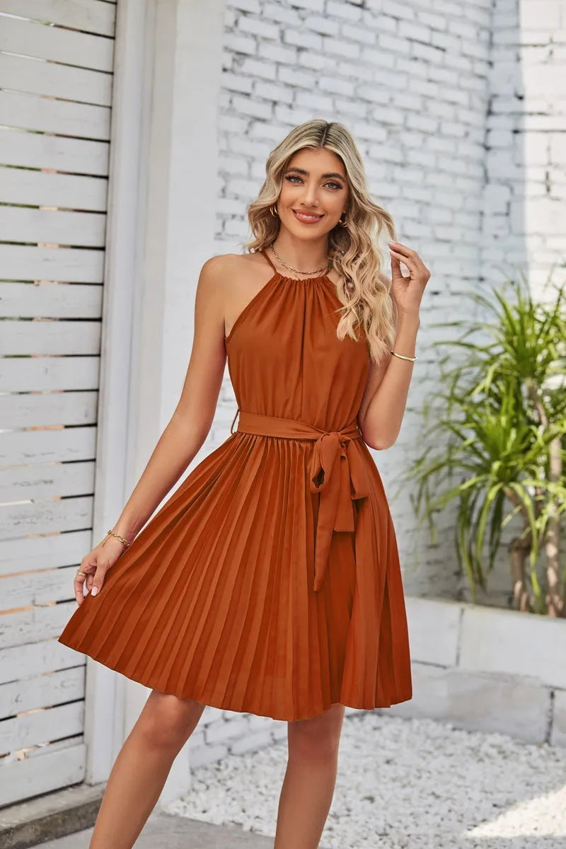 Women's black halter neck strapless dress with pleated midi skirt and waist belt