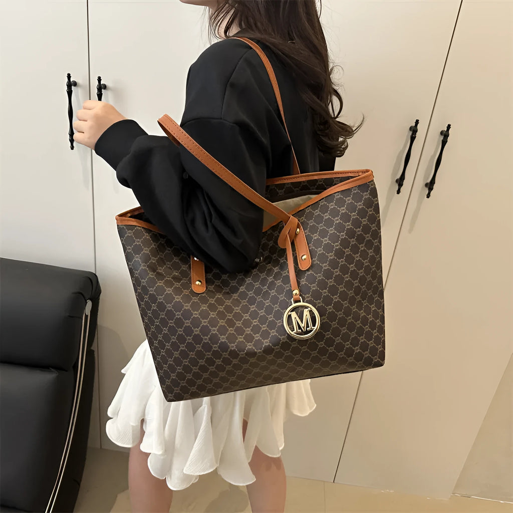 Structured black PU shoulder bag with sewing thread detail and a polyester lining.