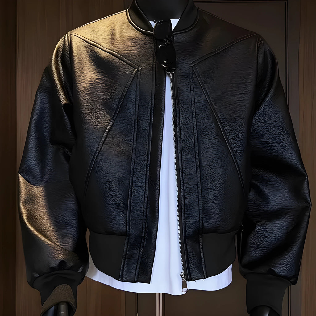 Men's black PU leather jacket with litchi grain texture, showing extended 100cm length and tight fit.