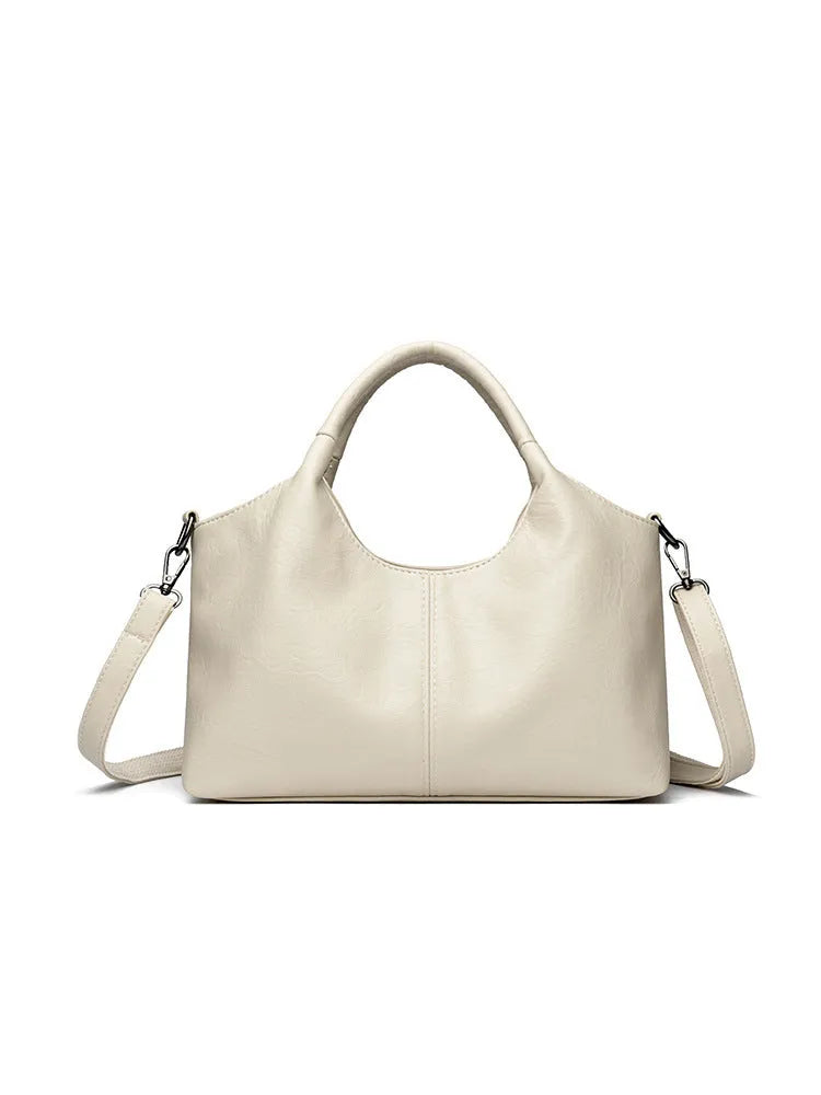 Genuine leather women's cross-body bag in a choice of seven colours including black, brown, and wine red