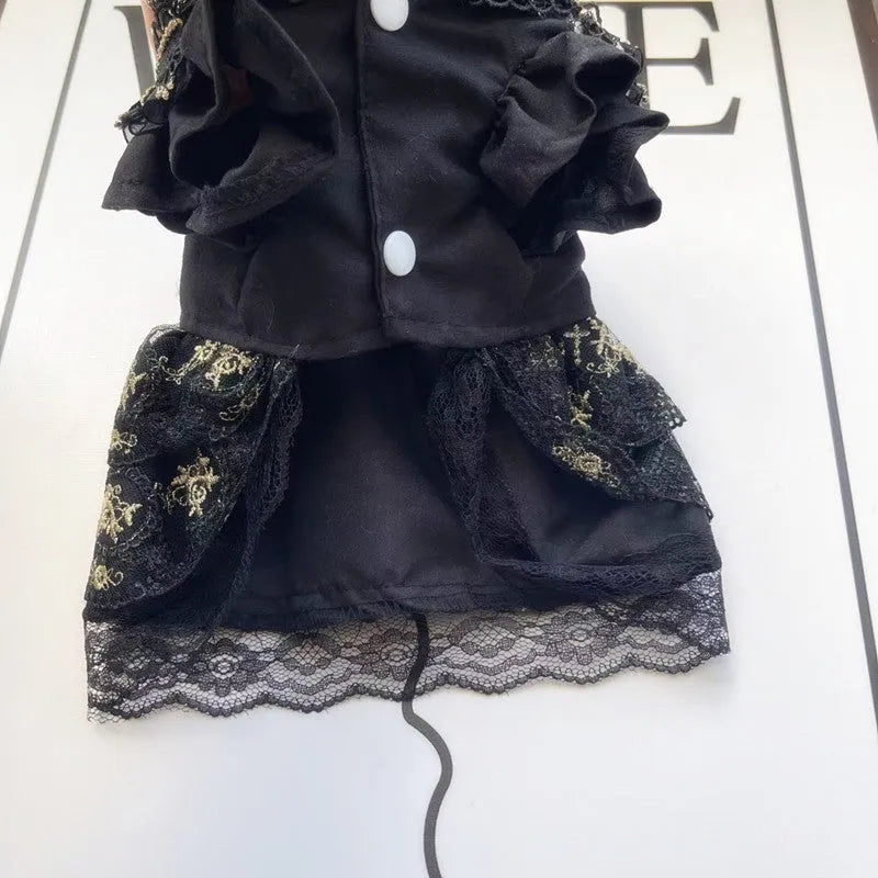Golden gothic princess style polyester dress for a small dog on a mannequin, showing black skirt detail.
