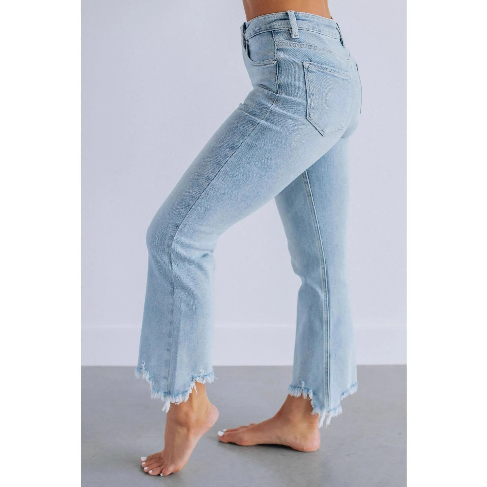 Women's dark blue cotton denim jeans with hand-distressed detailing and casual styling
