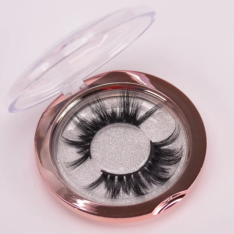 5D mink false eyelashes set with brush and storage cap on pink background
