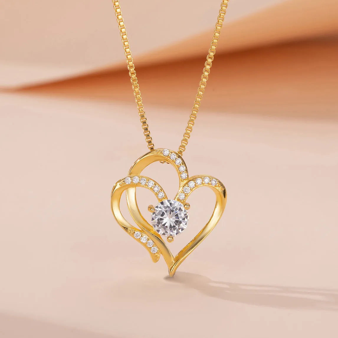 Simple heart-shaped women's necklace in 925 silver with choice of rose gold, platinum, or yellow gold plating.