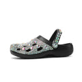 Black women's platform sandals with rhinestone details and a hole-patterned EVA upper.