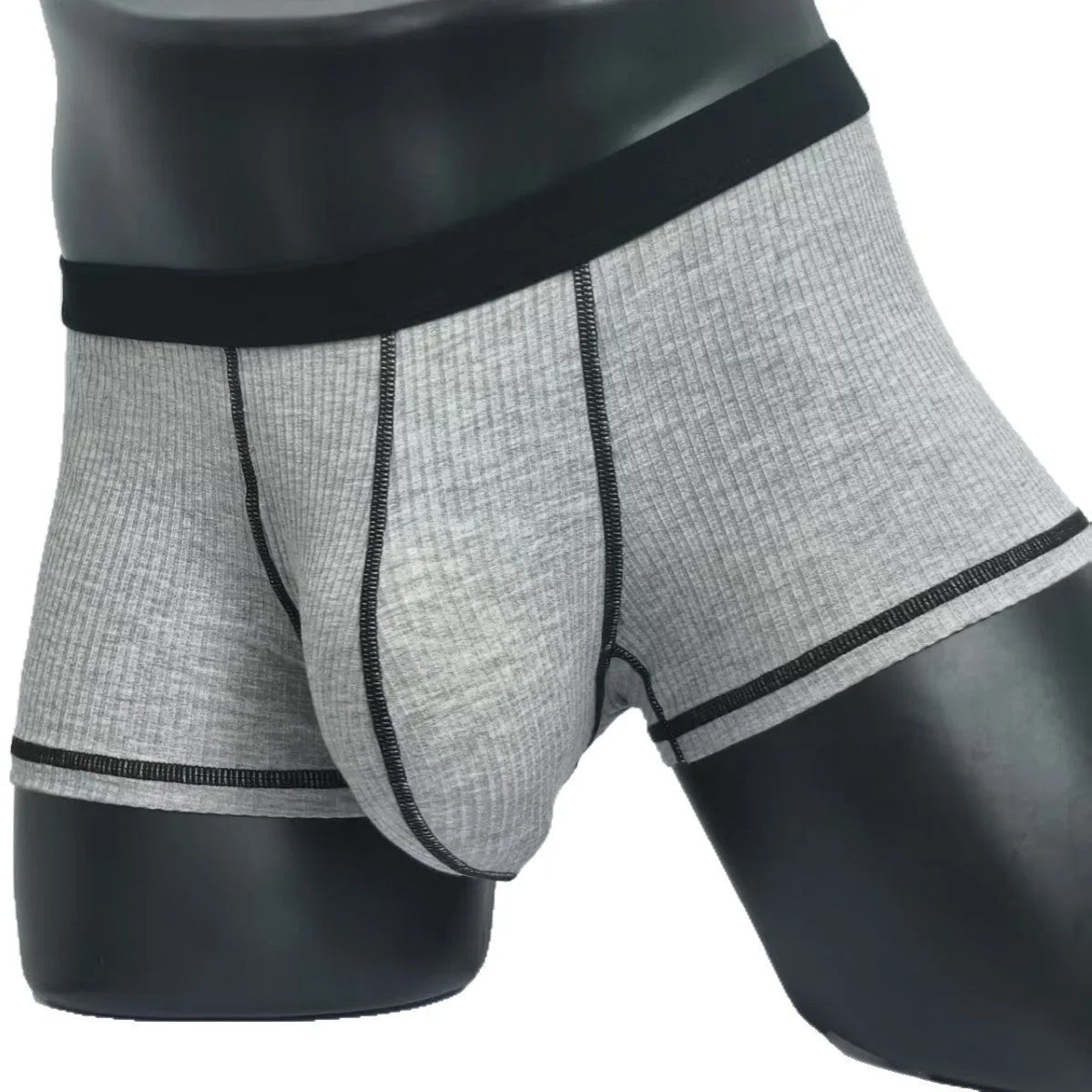 Solid-colour men's boxers in breathable fibre fabric on a size chart.