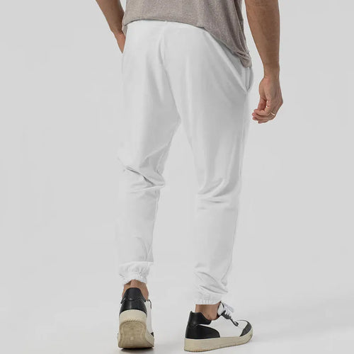 Men's grey casual tapered sweatpants with an elasticated waistband laid flat.