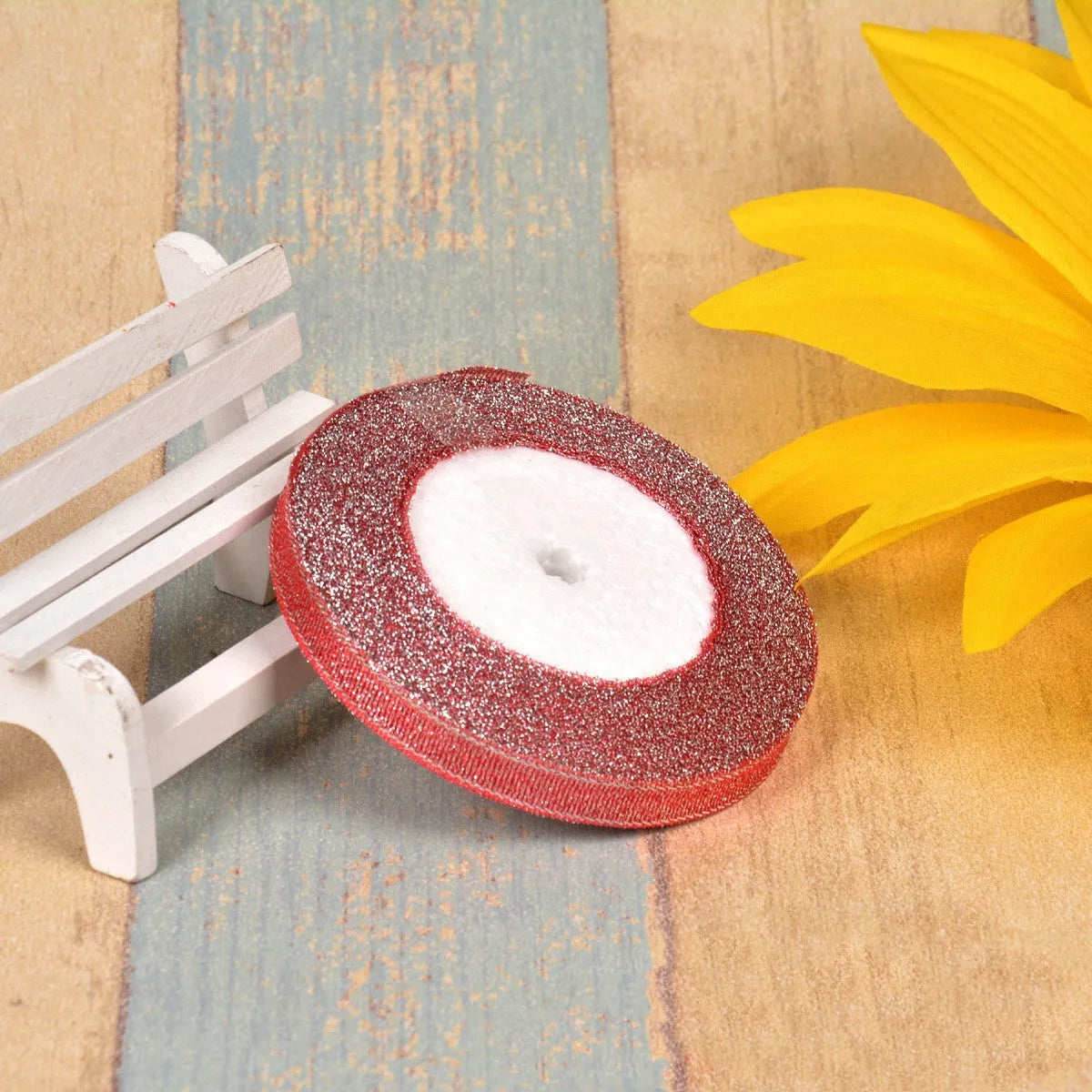 Polyester ribbon spool in metallic colours for decorative clothing and gift packaging trim