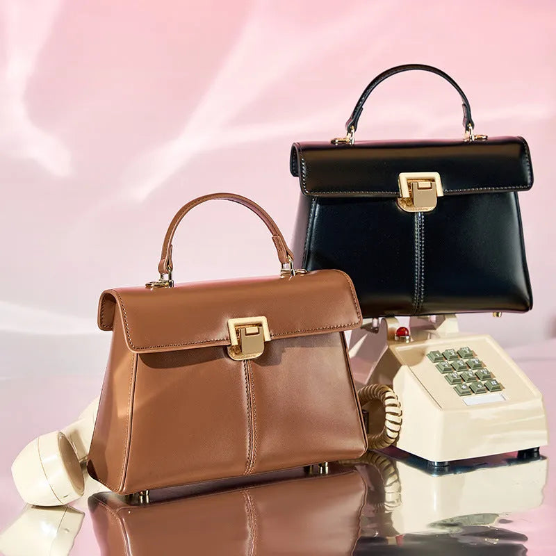 Women's black genuine leather shoulder handbag with vachette clasp in horizontal square shape