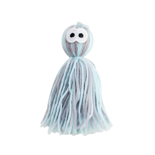 Blue grey wool ball cat toy with hanging loop next to a teaser stick.