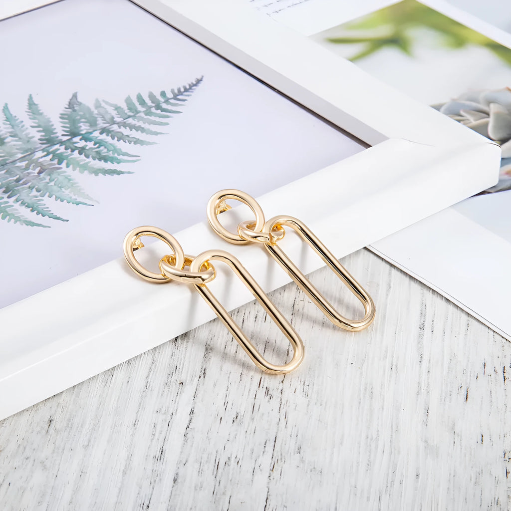 Sterling silver needle coloured geometric hoop earrings for women with ring and line design.
