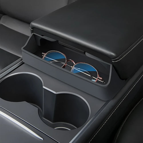 Black silicone sunglasses holder mounted on Tesla Model 3 centre console armrest