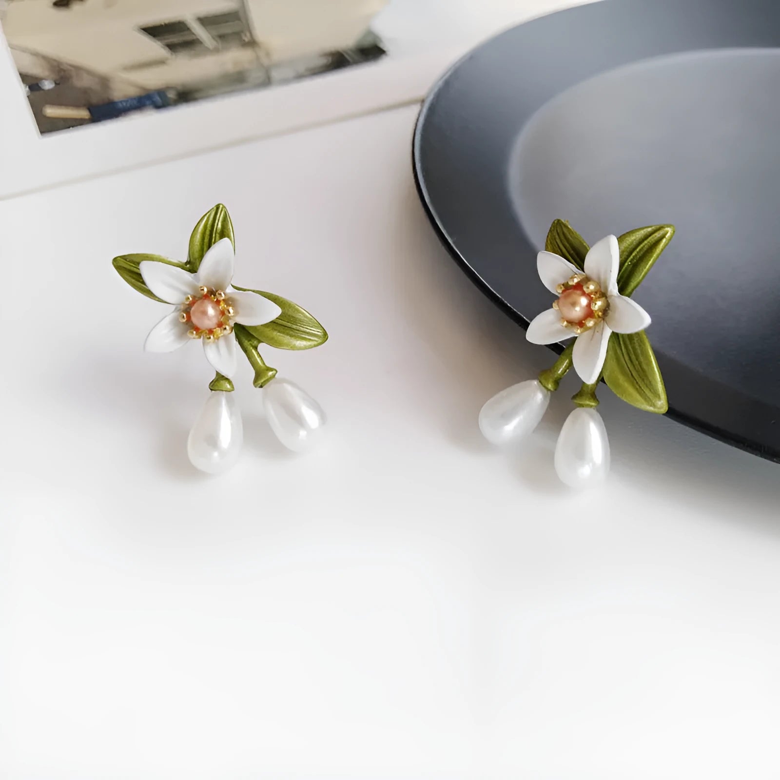 Sterling silver needle camellia earrings with flower ear clip design and contrast colour detailing