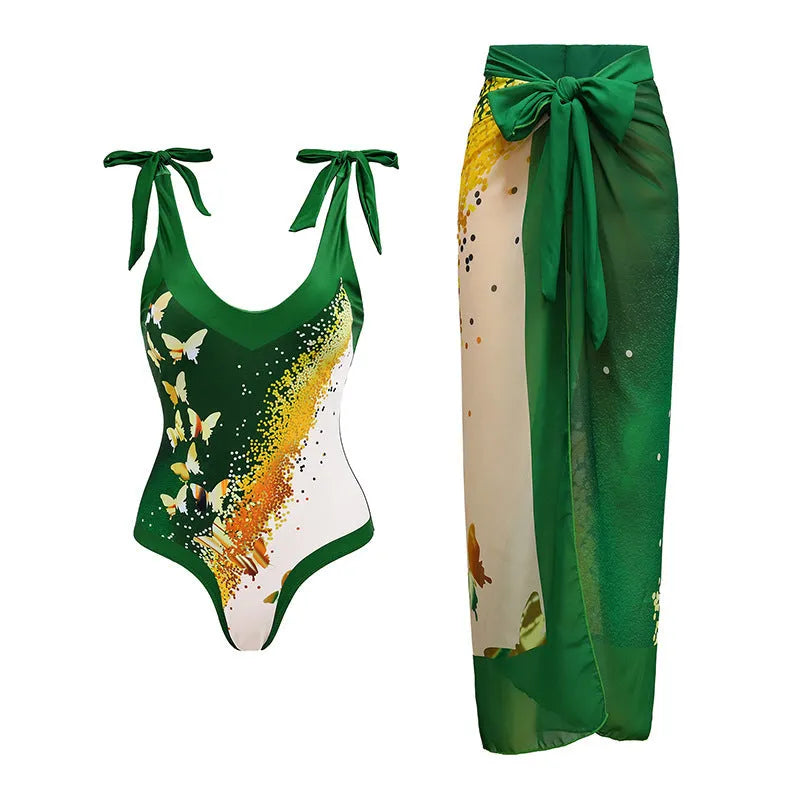 Women's solid colour one-piece swimsuit with spaghetti straps and a removable matching skirt.