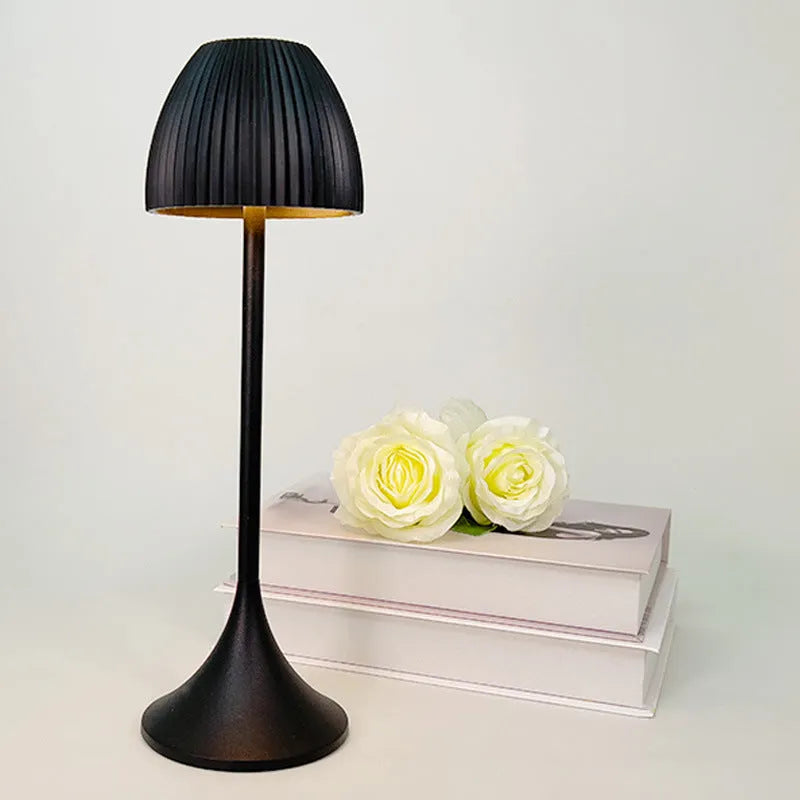 Modern small night lamp with thin round base in black or white, featuring dimming controls
