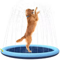 Blue inflatable dog sprinkler mat with water droplets on anti-slip surface, connected to a hose.