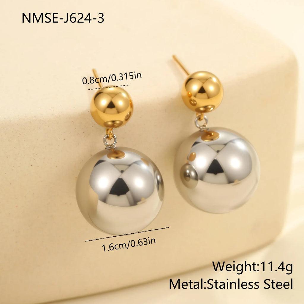 A pair of stainless steel stud earrings with 18K gold electroplated colour-block finish and round bead geometry design.