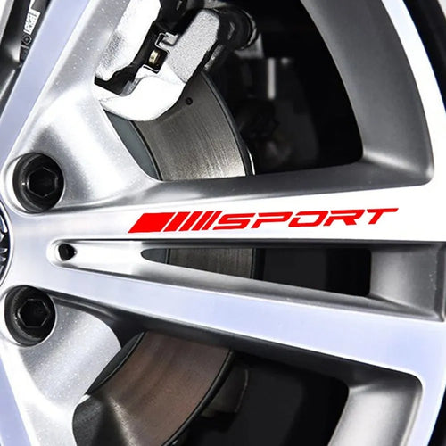 Hollow design red sports car rim sticker on alloy wheel