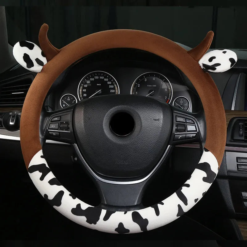 Short plush car steering wheel cover in black, showing soft texture and fitted design.