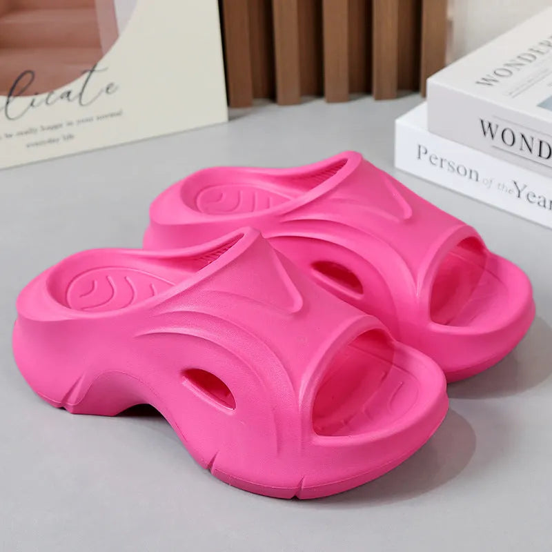 Women's thick-soled EVA slippers in rose red colour showing round toe design