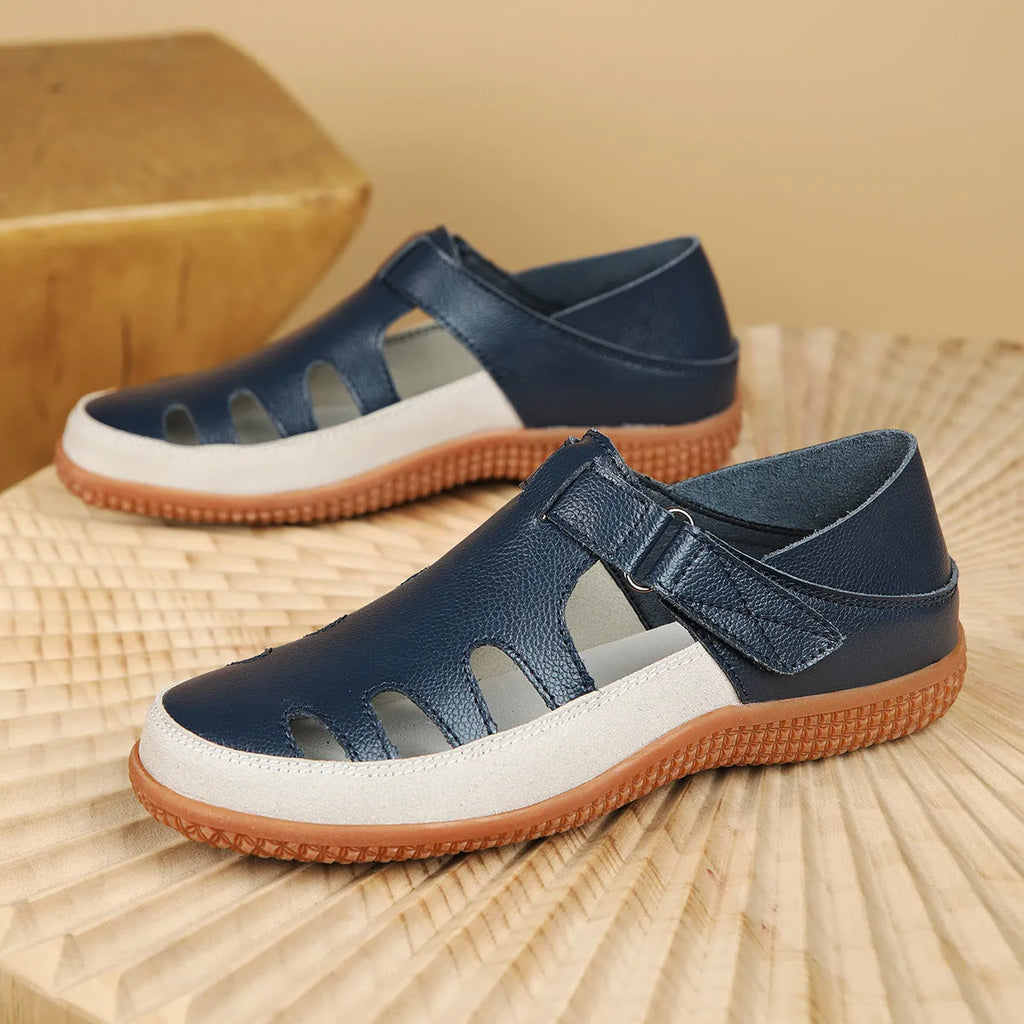 Plus size women's flat sandals in blue with hollow toe cap and thick rubber sole