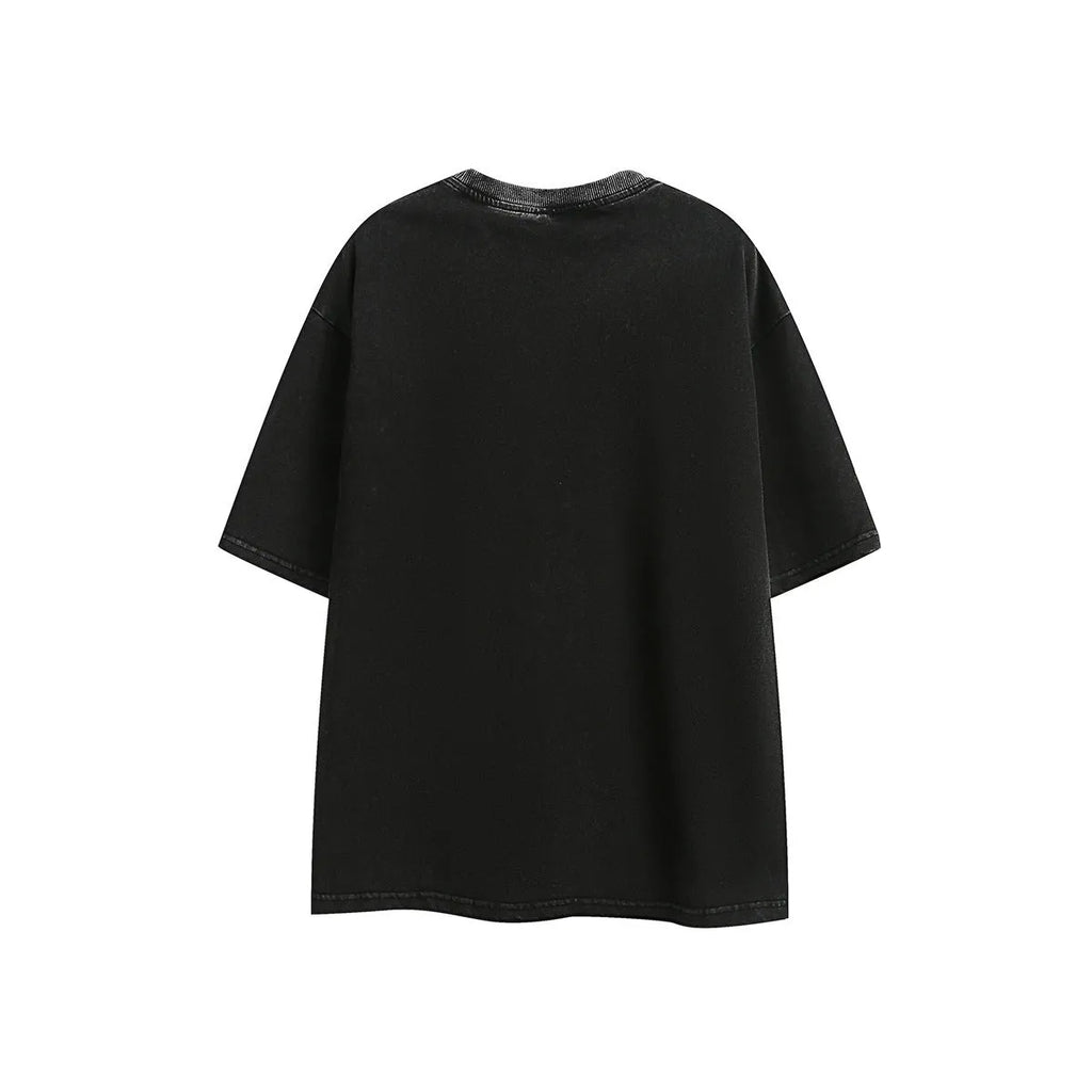 Purple and black loose-fit short-sleeved cotton t-shirt with embroidered retro design on a washed fabric.