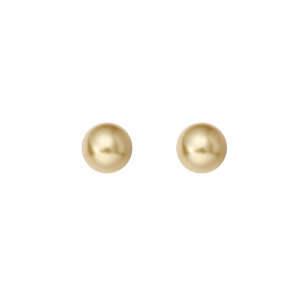 A pair of large geometric pearl stud earrings with a retro eight awn star motif on a silver setting.