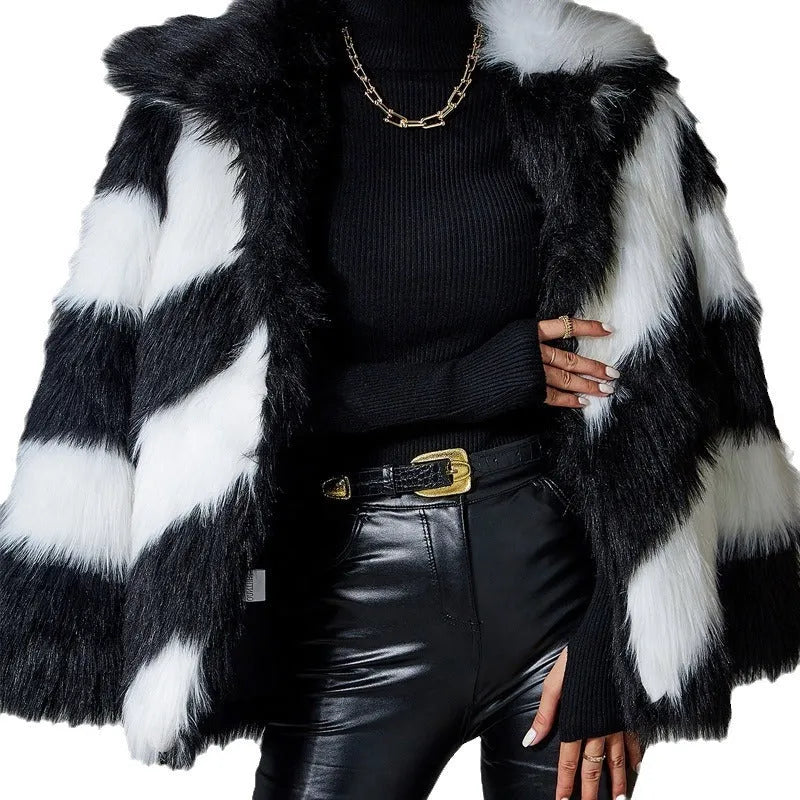 Women's faux fur coat with contrasting lapel detail and a detachable fur collar.