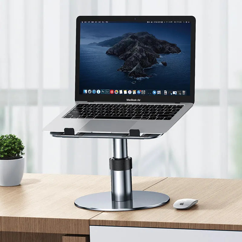 Silver adjustable car laptop stand with height settings and rotating base on a car seat.