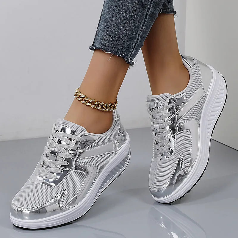 Women's gold platform shoes with mesh upper, round toe, and cross-strap detail