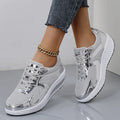 Women's gold platform shoes with mesh upper, round toe, and cross-strap detail