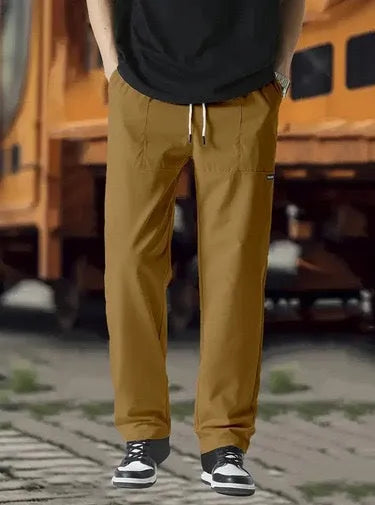 Men's light grey polyester trousers for spring and autumn casual wear, shown in Asian sizing.