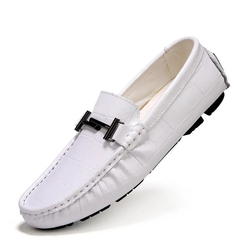 Men's black leather casual peas shoes with a belt buckle and flat rubber sole.