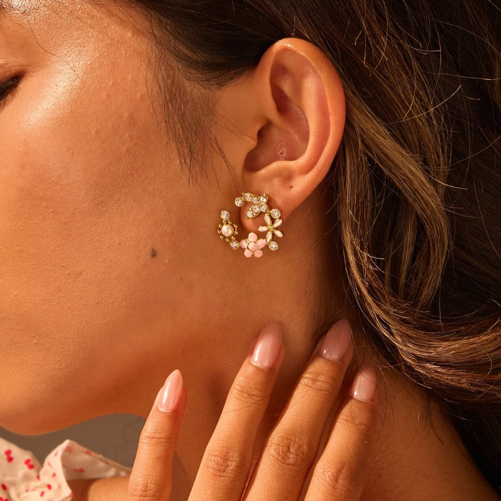 Gold flower stud earrings with petal design on stainless steel backing
