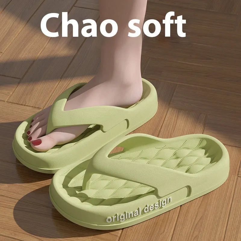 Men's green EVA flip flops on a beach, showing open toe and injection moulded sole design.