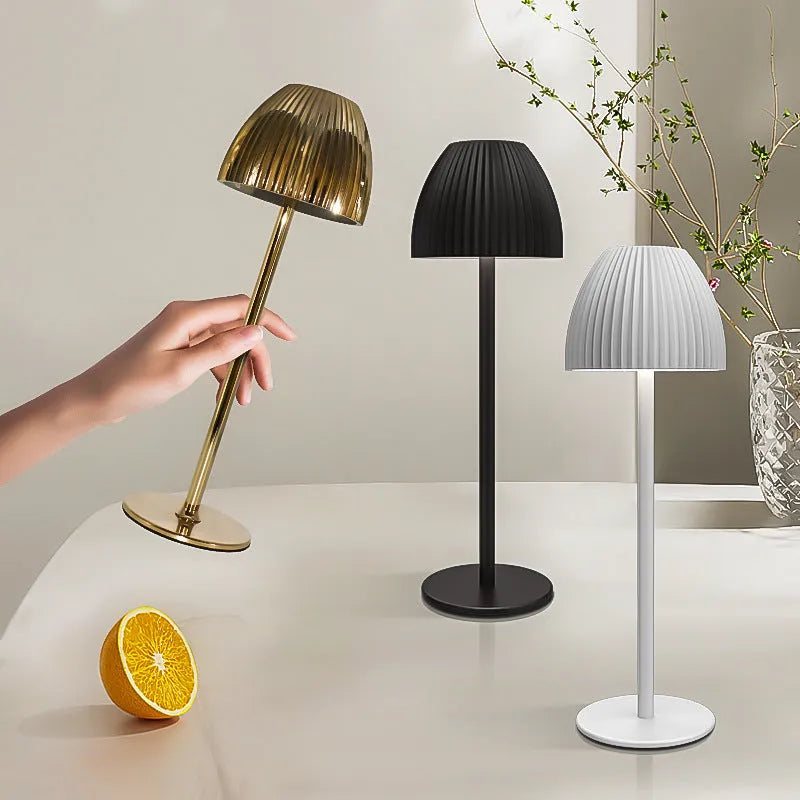Modern small night lamp with thin round base in black or white, featuring dimming controls