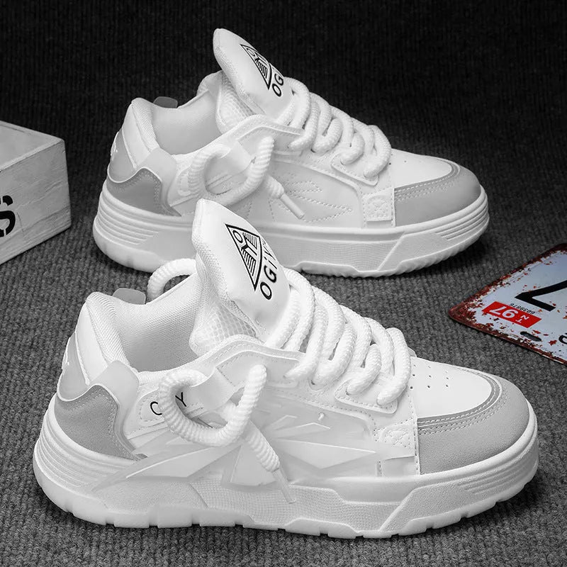 Men's white chunky sneakers with a cartoon totem pattern on the synthetic leather upper and a thick rubber sole.