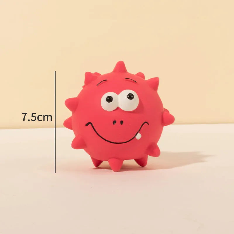 Four colourful squeaky dog balls with cute faces made from natural latex rubber with textured surfaces