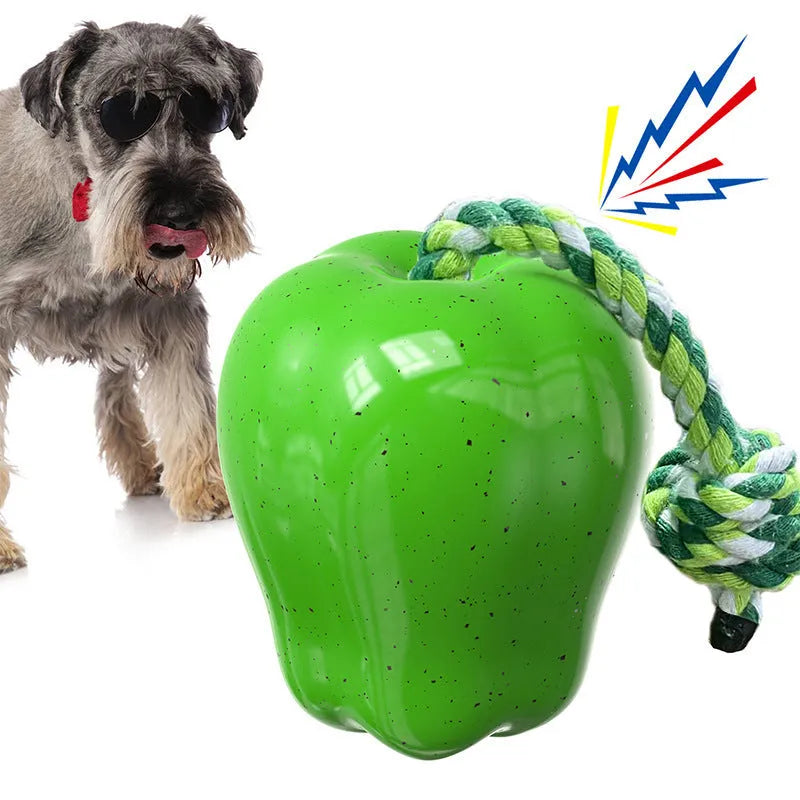 Plastic dog dental toy with dropping ball design for molar cleaning in green and red colours
