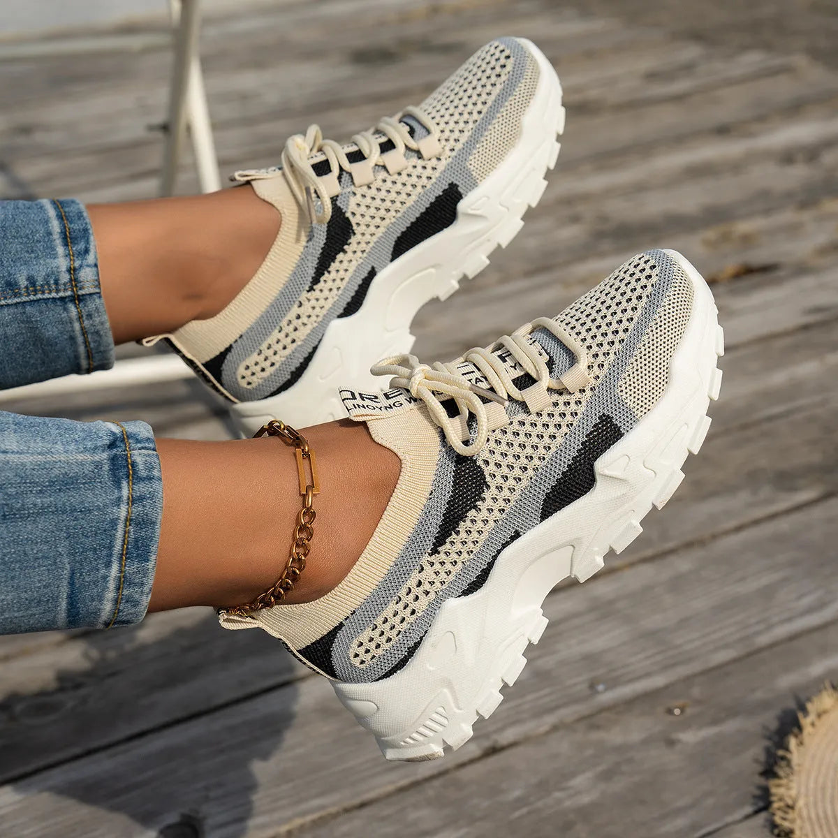 Women's Flyknit mesh lace-up sneakers in multiple colours on a rubber sole.