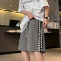 Men's casual baggy track pants in micro-elastic polyester available in sizes M to 5XL