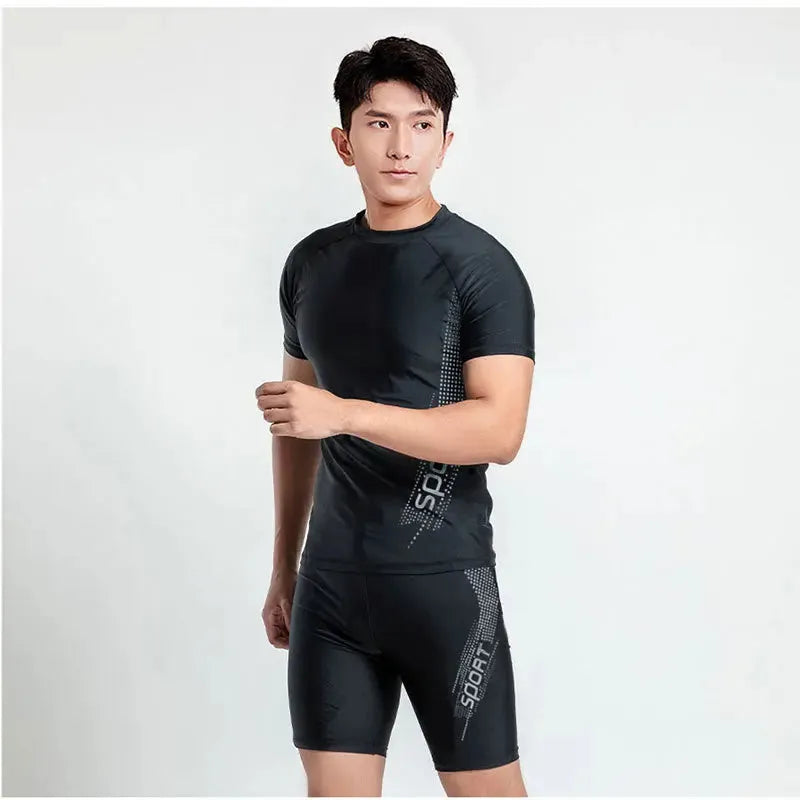 Men's plus size swimming set featuring a rash guard top and matching swim shorts on a grey background.