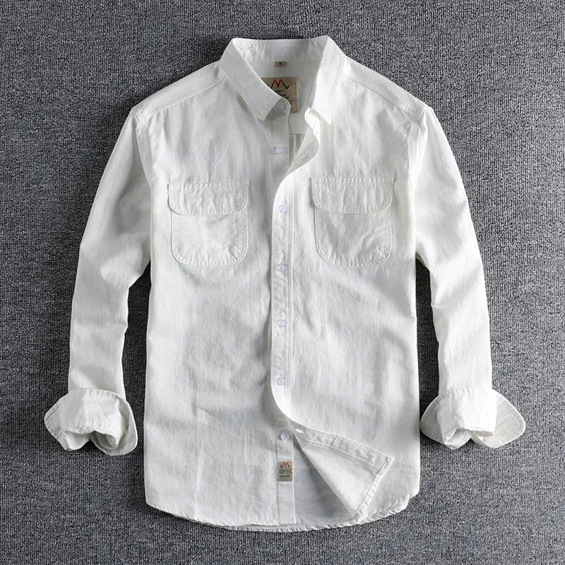 Men's solid colour cotton long sleeve shirt in a cardigan style on a hanger.